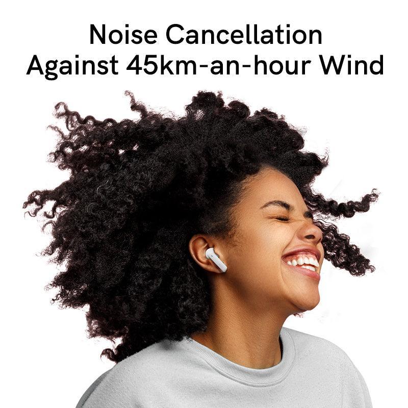 Black QCY MeloBuds ANC earbuds with noise cancellation against 45km/h wind, shown on model enjoying music.