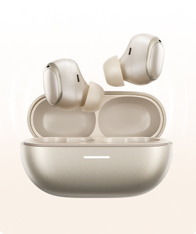 Auriculares sem fios cinzentos numa estação de carregamento aberta, design moderno com superfície brilhante.