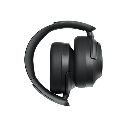 Auscultadores Over-Ear Schwarze QCY H3S, vista lateral esquerda com arco ajustável e superfície mate.